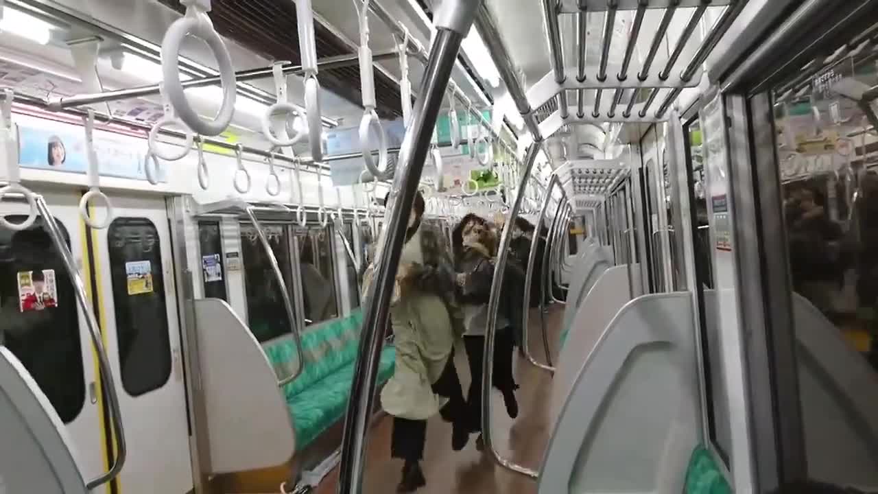 Man with a knife sets a train in Tokyo on fire