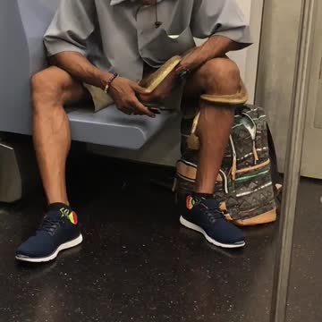 Man blue shirt snake on hand and leg