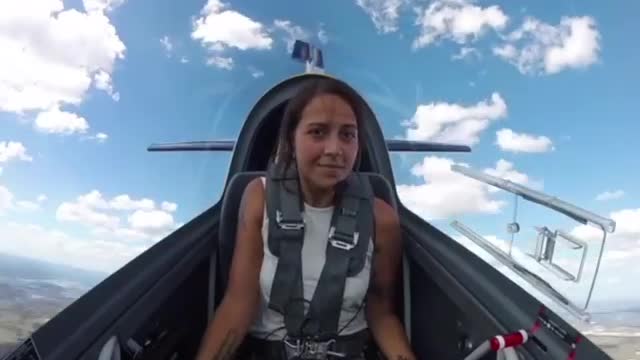 Female pilot flies a totally flat spin in the Extra 330LX stunt plane.