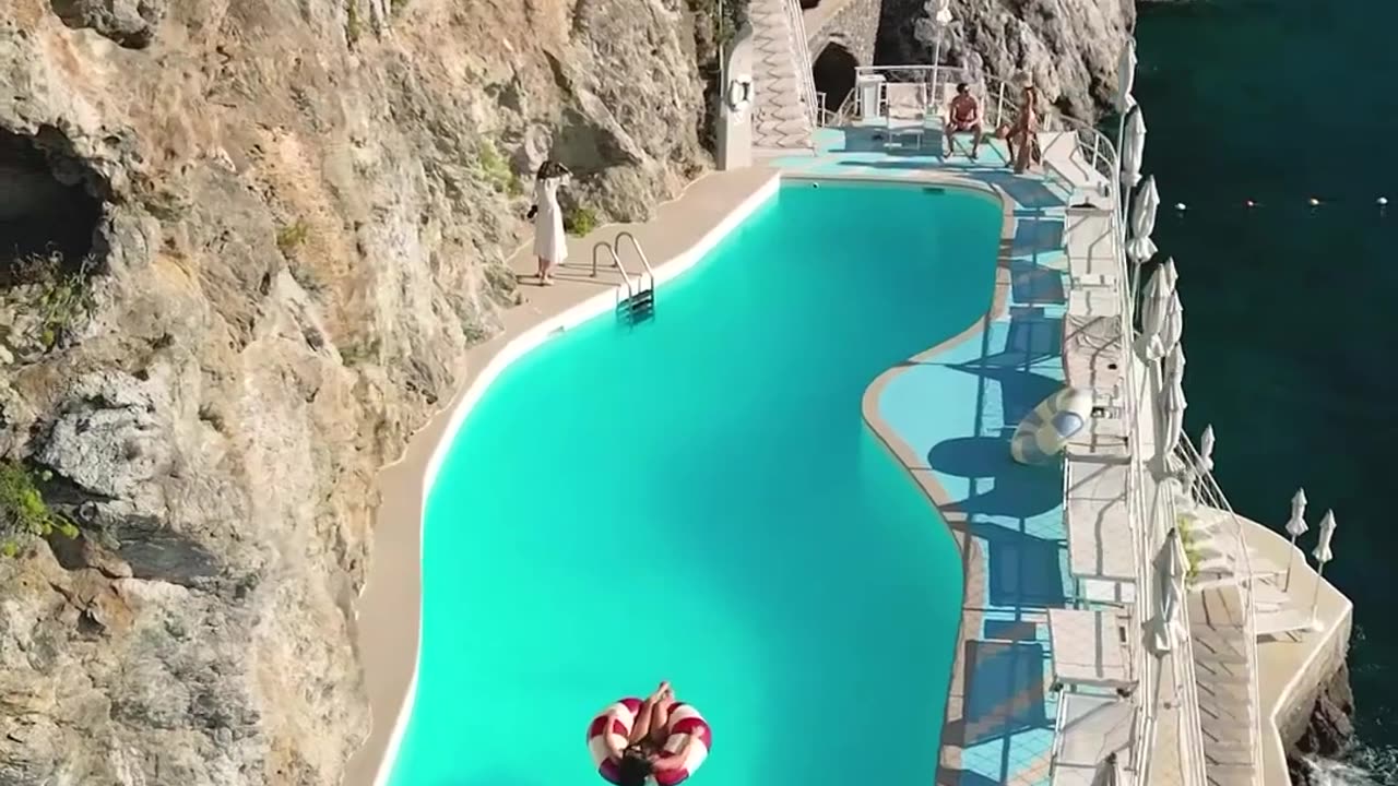 Salt water pool on a rock ledge overlooking the Amalfi Coast, Italy.