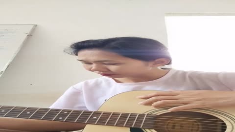 Thai sister trying her guitar