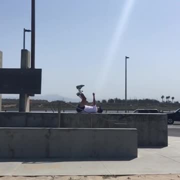 White shirt guy on back kicking and punching in air