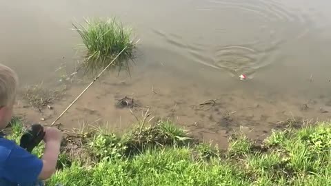 Siblings Use Encouragement to Catch Fish