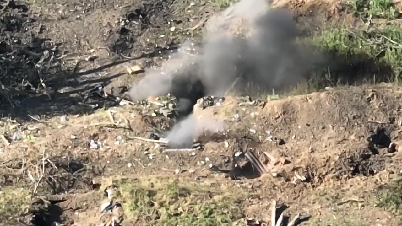 FPV drone scores a direct hit on a couple of Russians crammed into a dugout.