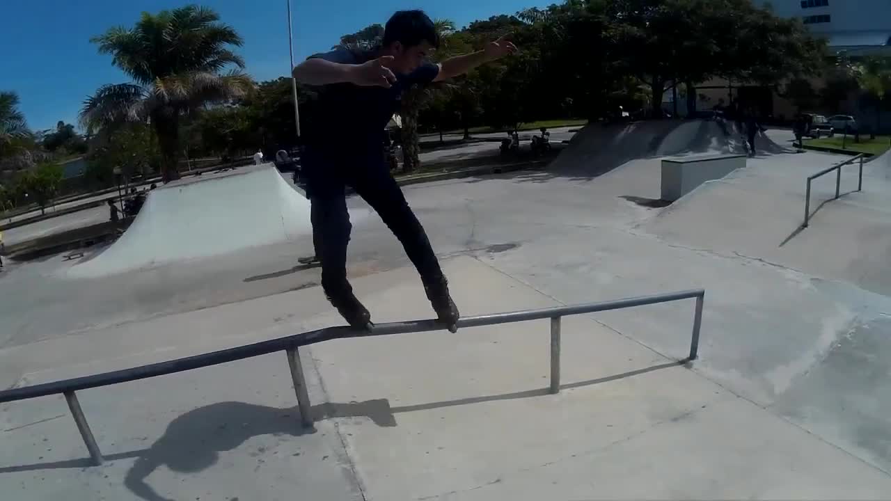 Inline skate rail grind faceplant