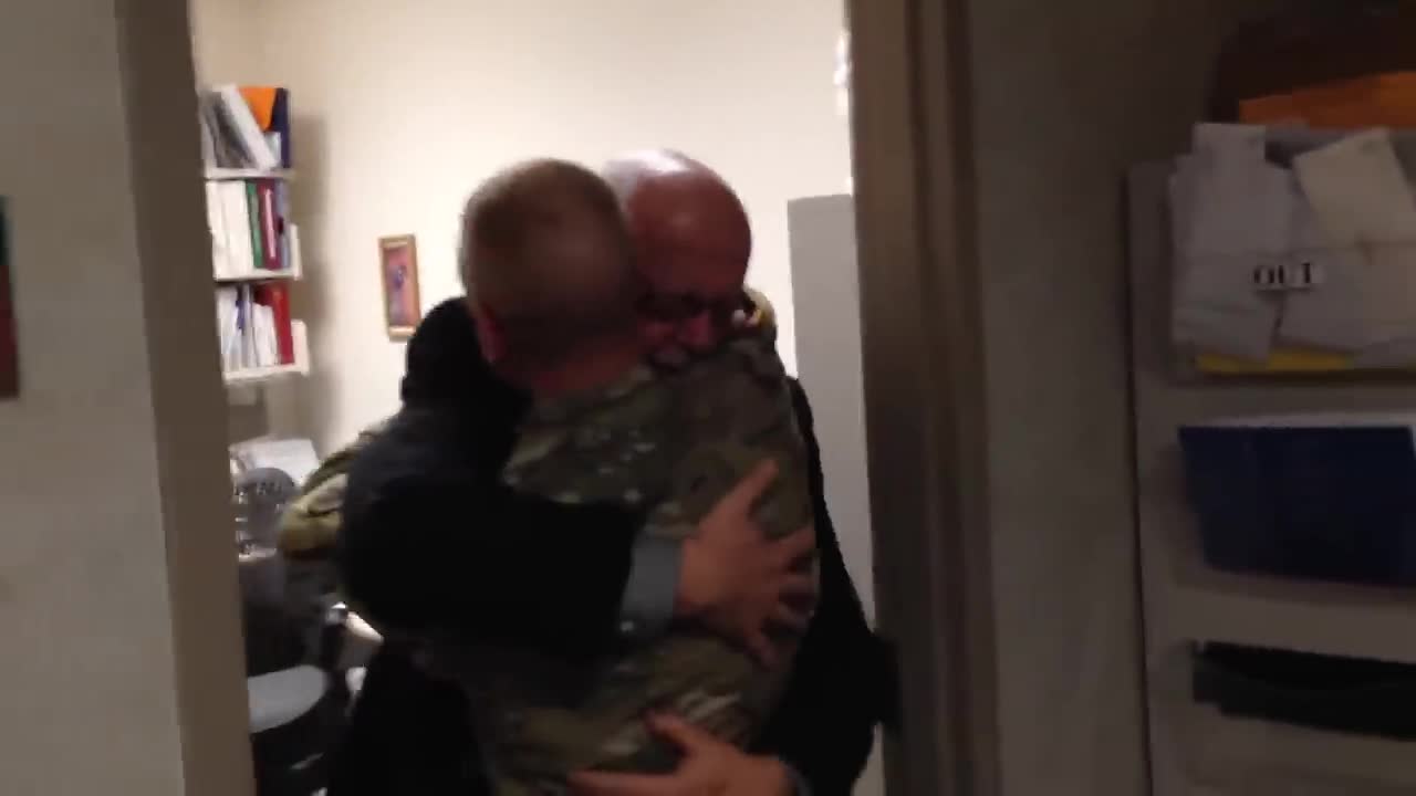 Dad breaks down when son returns home early from Afghanistan