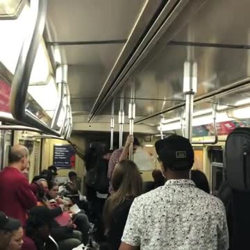 Guys play hip hop music and take over pa system on train