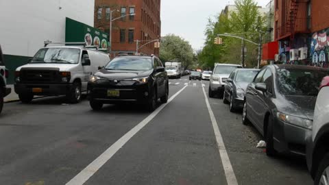 2021 0421 1152 am NYPD 3731 officers walk to the bikers' lane as I approach