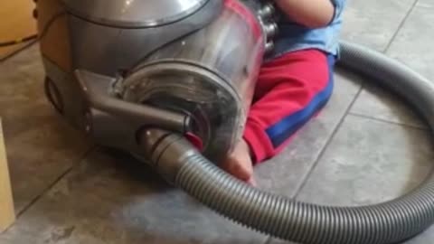 Cute baby loves playing with machines