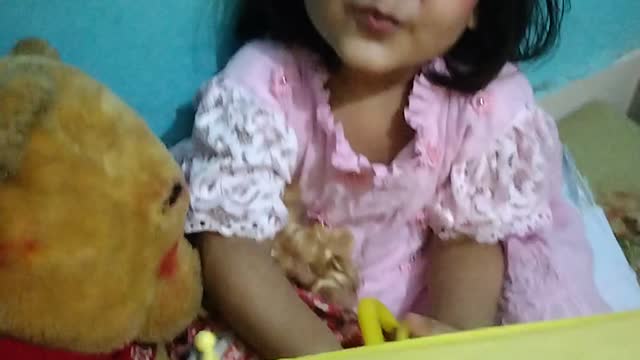 adorable baby girl playing with umbrella.