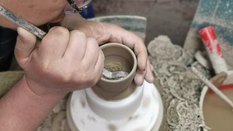 making of master cup of ceramic art.