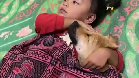 Little Girl Cuddles With Dog