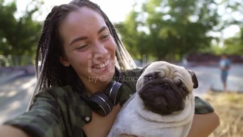 Young girl holding her dog.