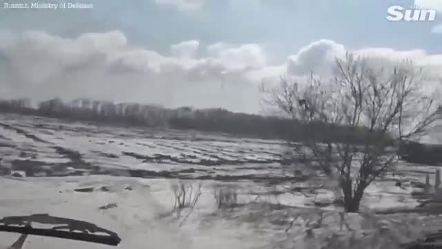 Russian military convoy moves through Kharkiv region, littered with destroyed tanks