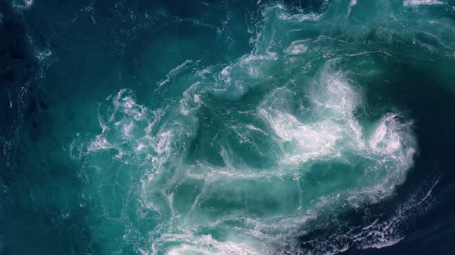 waves of water of the river and the sea meet each other during high tide and low tide