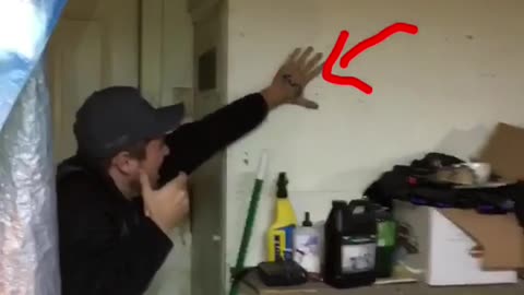 Guy shoots blow dark at friends hand and hits it between his fingers