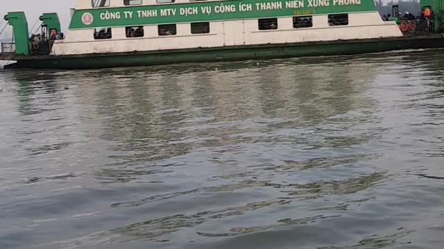 a ferry trip takes guests across the Saigon river