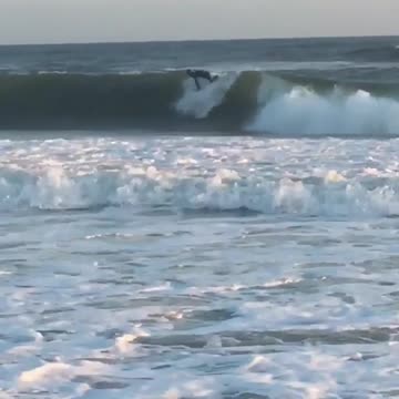 Guy washes out in wave and surf board flies up