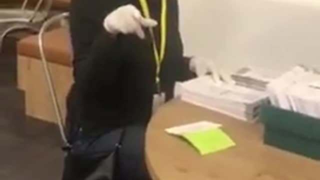 Women counting fraudulent ballots in a basement 2020 presidential election.
