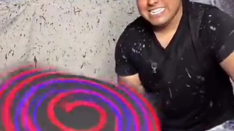 Making spin art while it spins on a drill