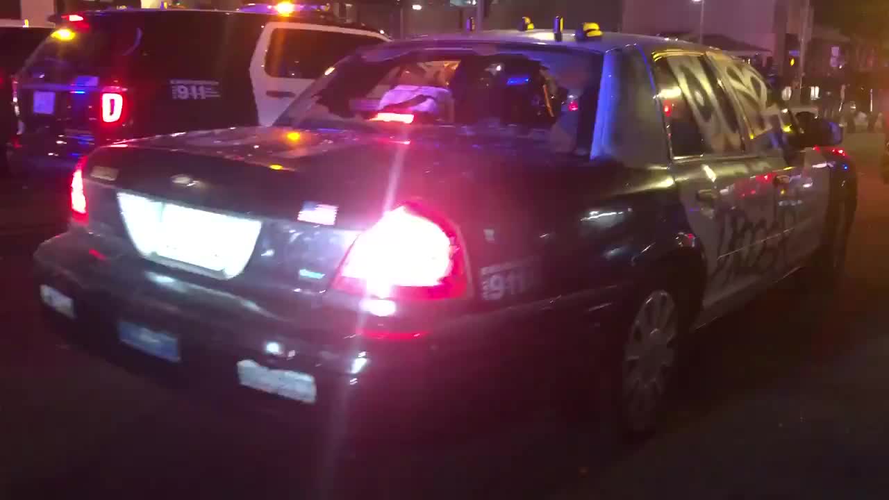 Lapd police car smashed windows and graffiti while officer in the car.