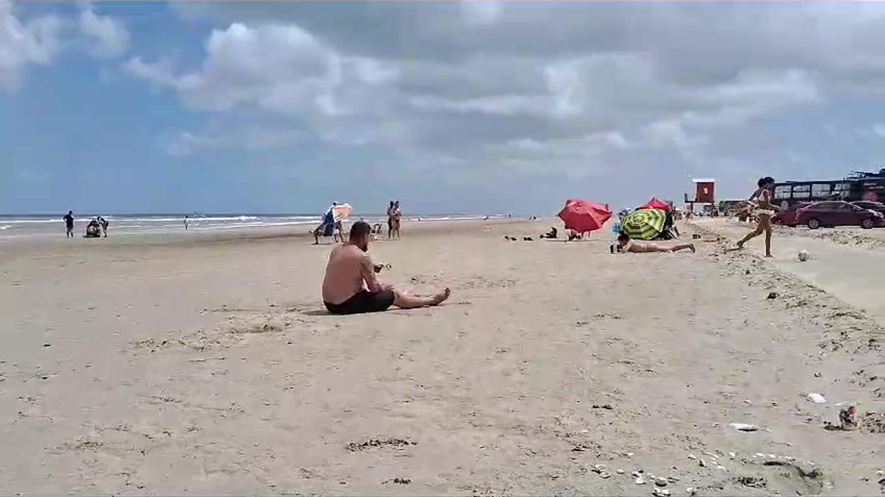 Man Falls Trying to Pass Soccer Ball at the Beach