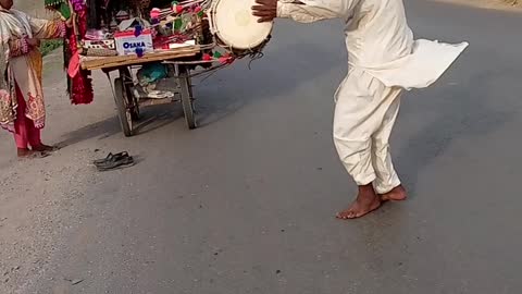 Old man playing dram