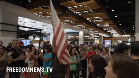 Dozens of Anti-mandate activists enter a vaccinated only food court