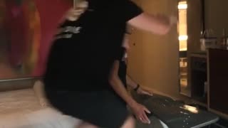 Hotel room two men wrestle