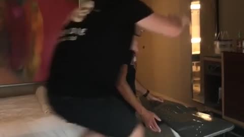 Hotel room two men wrestle