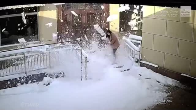 Woman falls into deep snow trying to reach for chilled wine