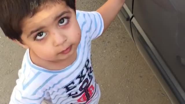 One Year old baby trying to open his car lock