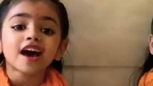 Hindu child singing Ramayana song