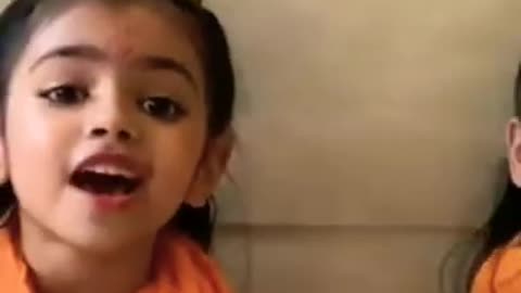 Hindu child singing Ramayana song