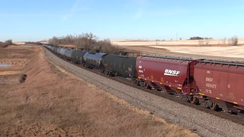 BN SD60Ms Across the North Dakota Sunrise