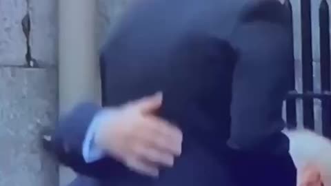 Look at Prince Andrew's hands