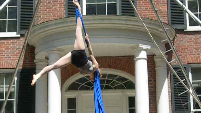 Woman performs aerial silks routine