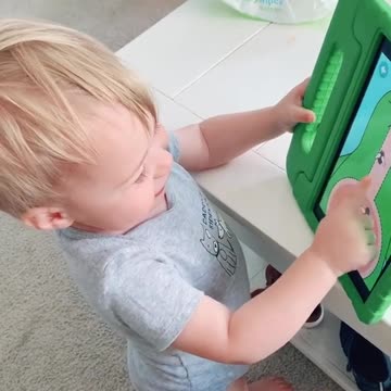 Little baby laughs and plays