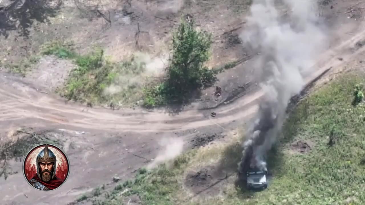 Ukrainian Drags His Comrade Away From a Burning Armored Vehicle