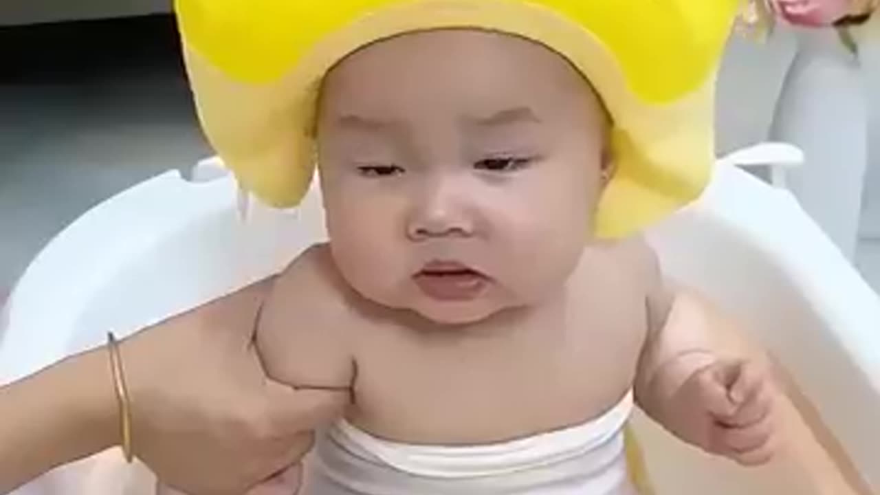 Chinese father bathing his child