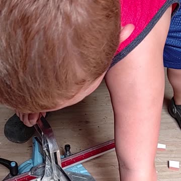 5 yr old cuts tile for the first time
