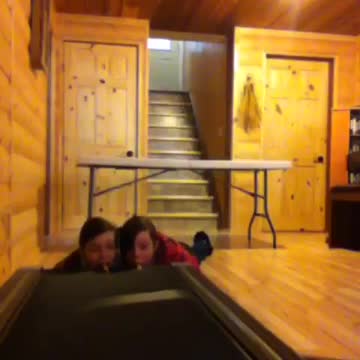 Girls Eat Goldfish Crackers Off Of Moving Treadmill