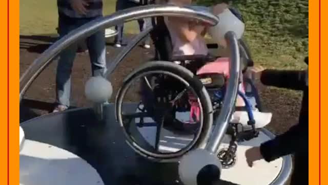 disabled child playing on the spinner