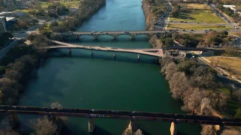 Big river with bridges in a city in an aerial view
