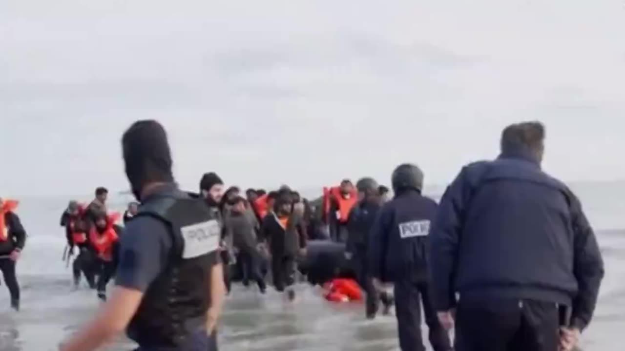 French police puncture a dinghy carrying "asylum seekers" bound for UK.