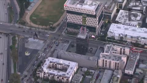 Man climbs KTLA radio tower holding ‘Free Billie Eilish’ sign in Los Angeles