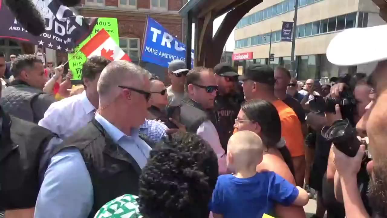 An angry group of protestors in Belleville moob Trudeau