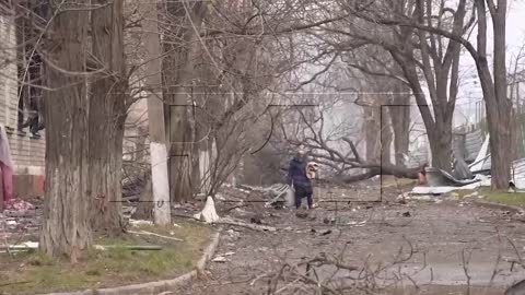 Russian marines take the lost grandmother out of the battlefield, after which the armored personnel carrier begins to work on the positions of the Azov national battalion