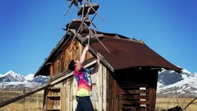 Man Creates a Tower Of Chair And Balances Them On His Chin