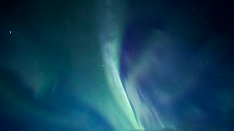 Northern Lights of blue and green colors in the night sky